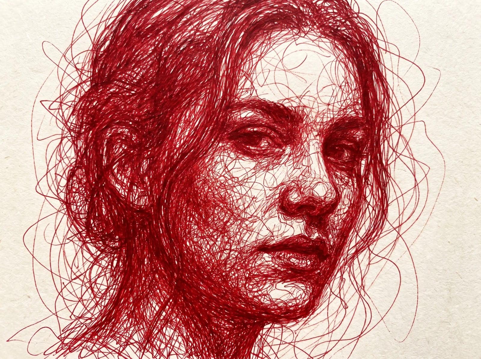 Red Scribble Portrait, A face built entirely from tangled red pen line on textured paper
