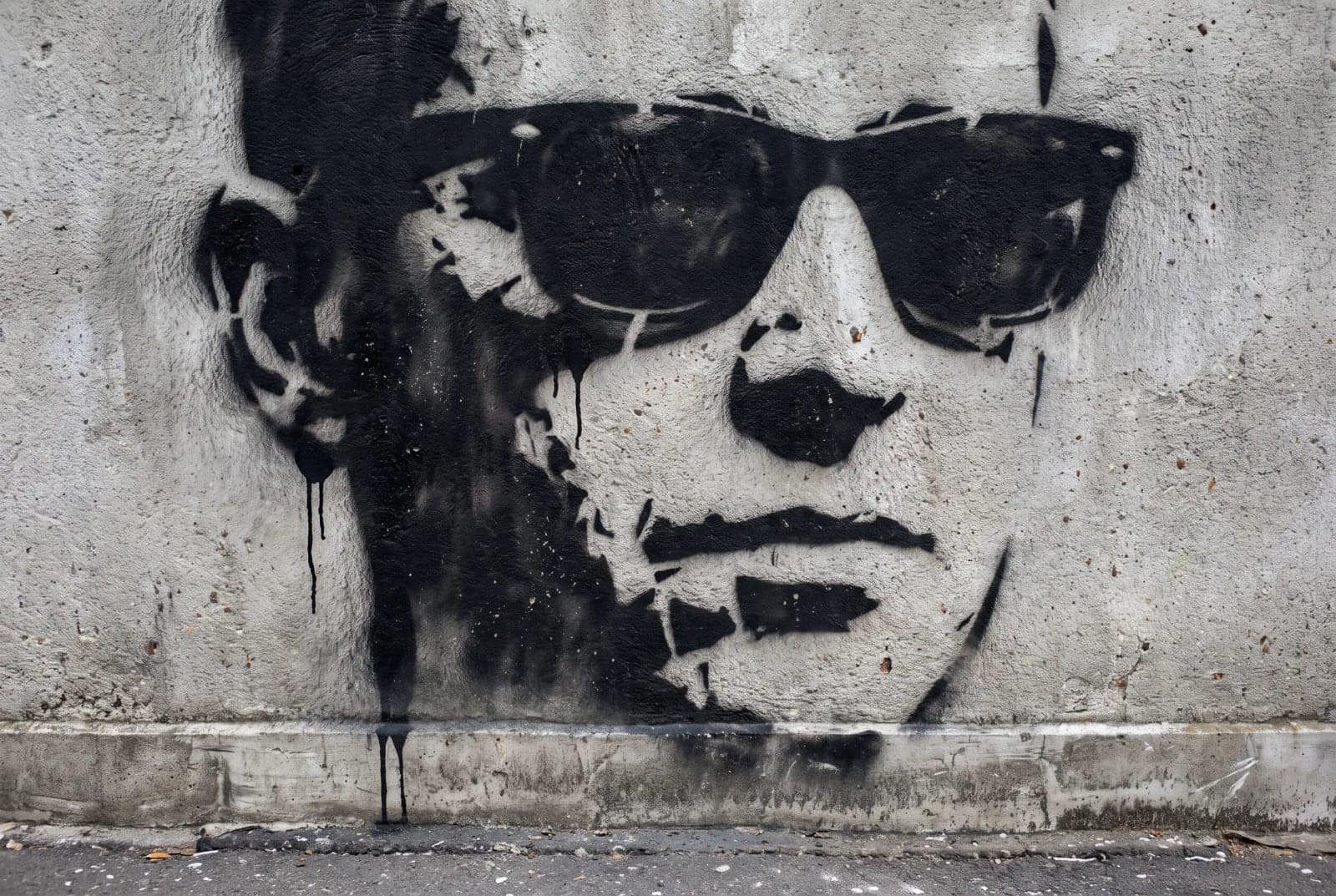 Stencil Street Art, A cut stencil sprayed on a real wall, with overspray and drips