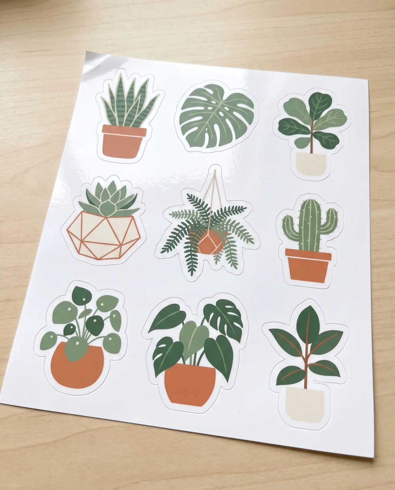 Sticker Sheet, A grid of die-cut stickers with white borders, shot on the sheet