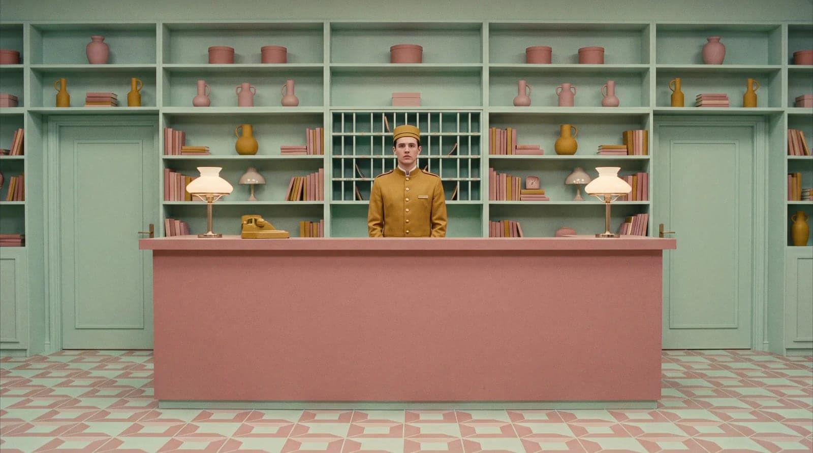 Symmetrical Pastel Film Still, Dead centre framing, a pastel palette and someone staring down the lens